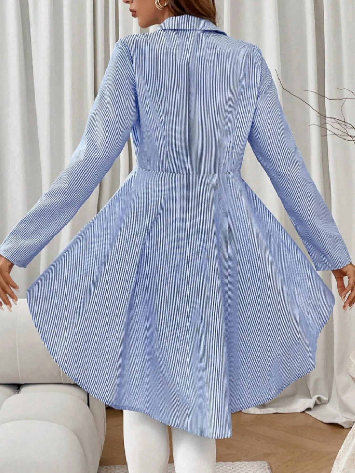 A women's blue and white striped waist irregular hem shirt, commuting style slim lapel long-sleeved top